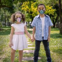 girl and boy wearing styleseal pro masks