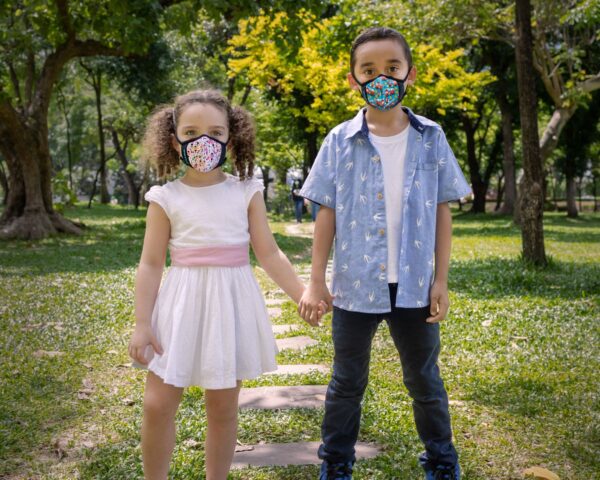 girl and boy wearing styleseal pro masks